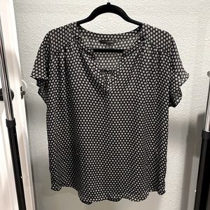 Black blouse with white floral pattern